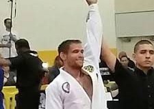 Travis-Tooke-hand-raised